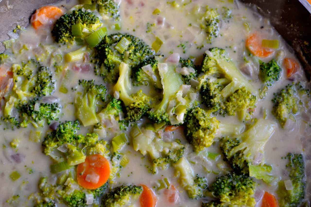 Coconut creamy broccoli and carrots in a pan