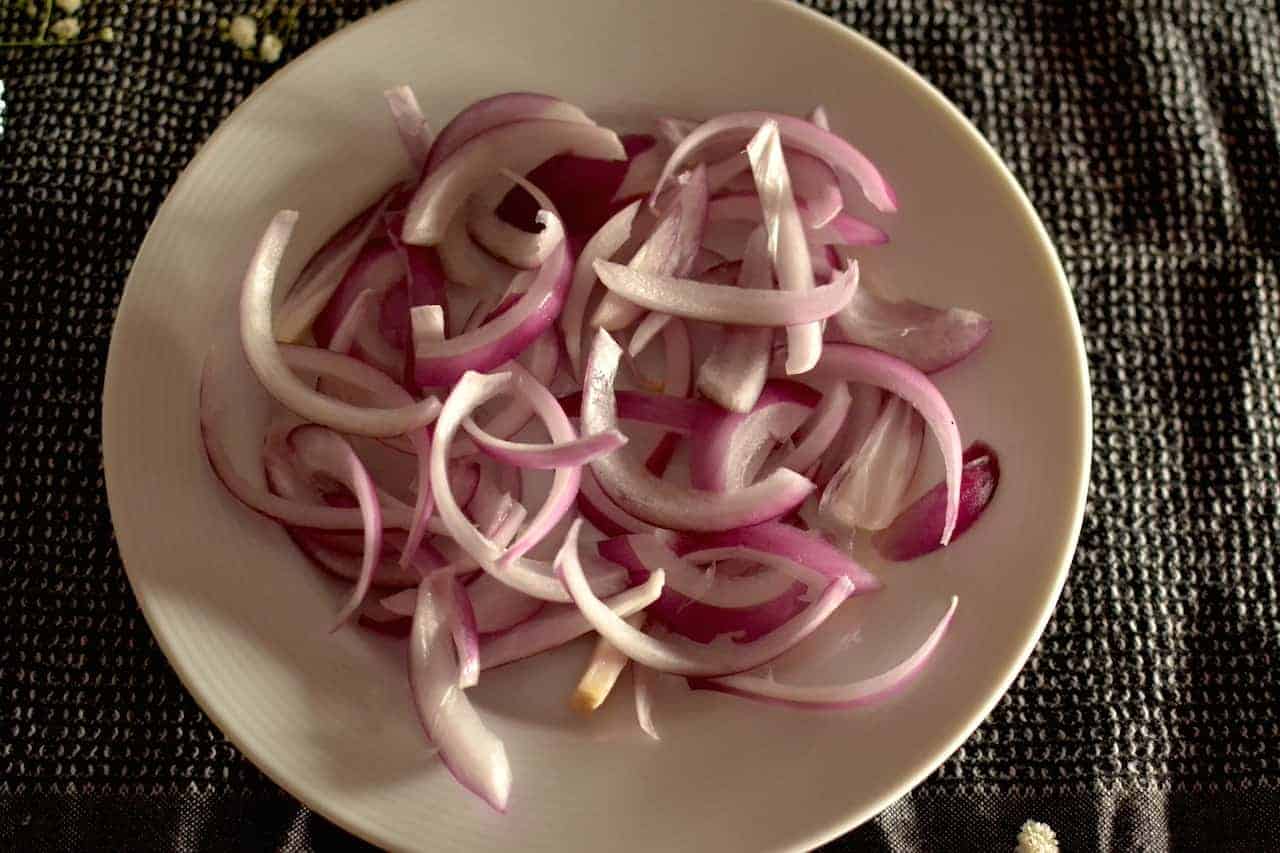 Sliced onions in a white plate 