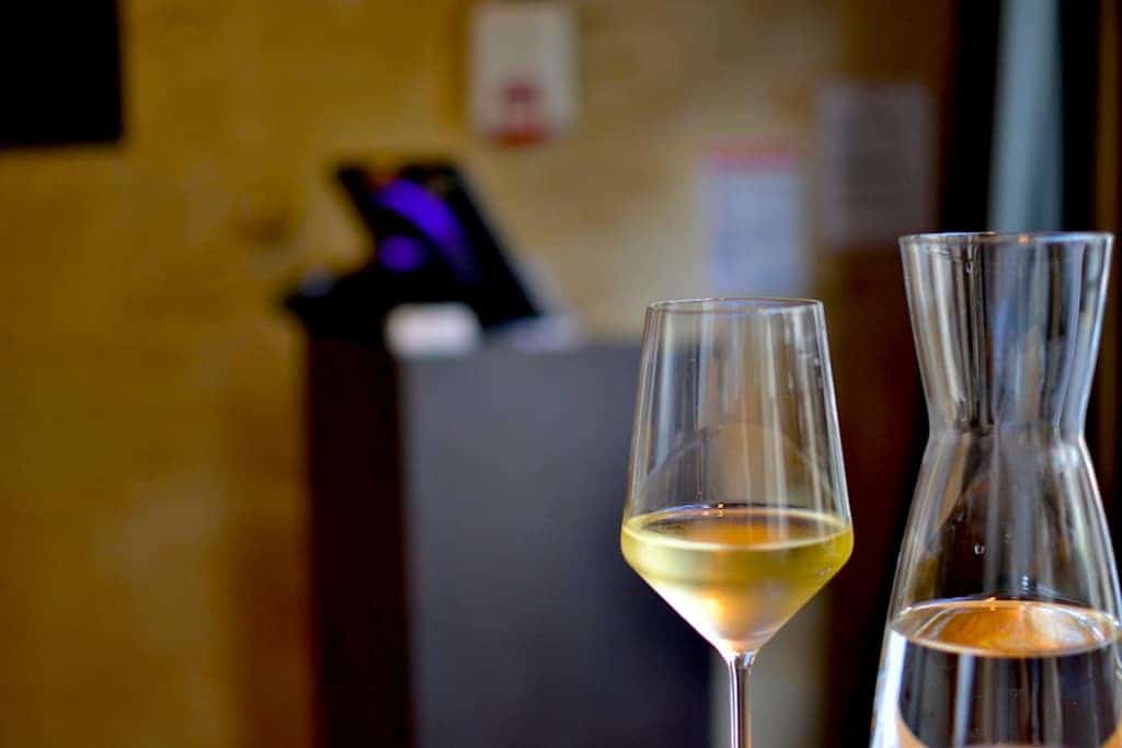 A glass of white wine n Saint Emilion village