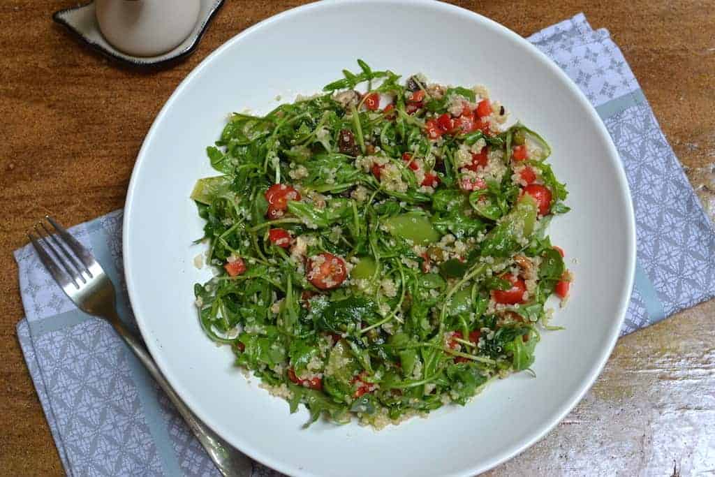 quinoa salad with lemon dressing in a wooden table
