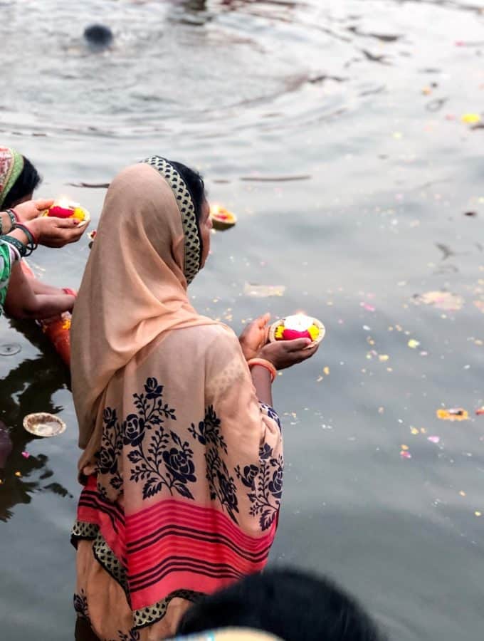A woman is praying in Ganges River, Varanasi