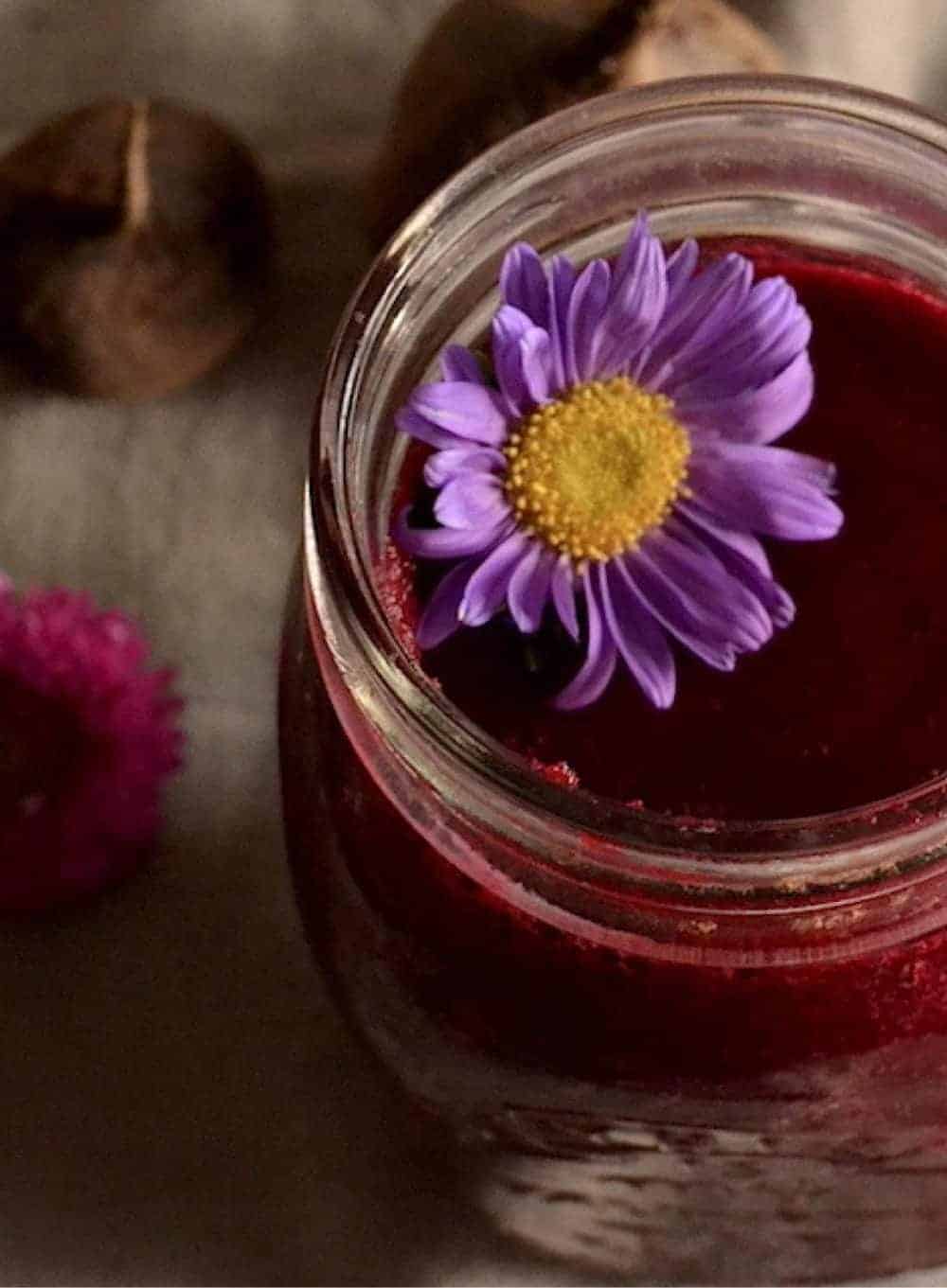 Beetroot smoothie with a purple flower on the top -- Vegan Easter Recipes