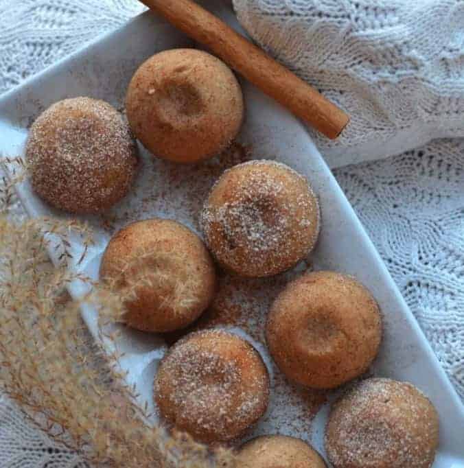 8 CHURROS MUFFINS in a white plate with a piece of cinnamon