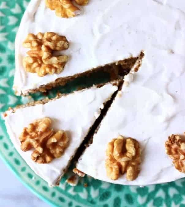 A piece of White cAROT CAKE WITH walnuts