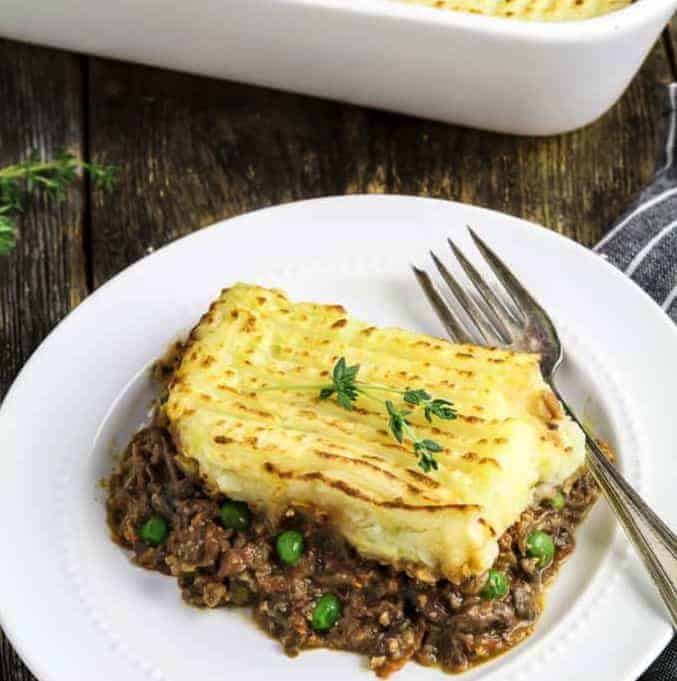 SHEPHERD’S PIE in a white plate with a fork - - Vegan Easter Recipes