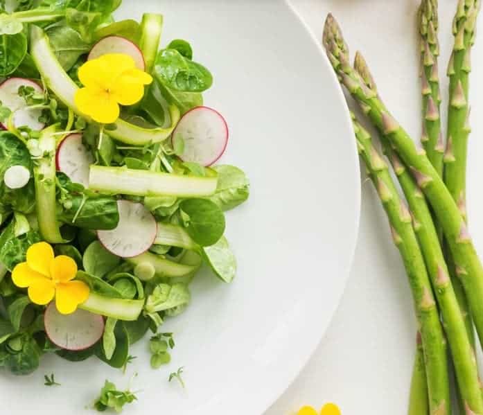 SUPER SPRING SALAD in a white plate with asparagus - - Vegan Easter Recipes