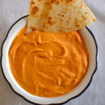 red pepper bean hummus with sliced bread