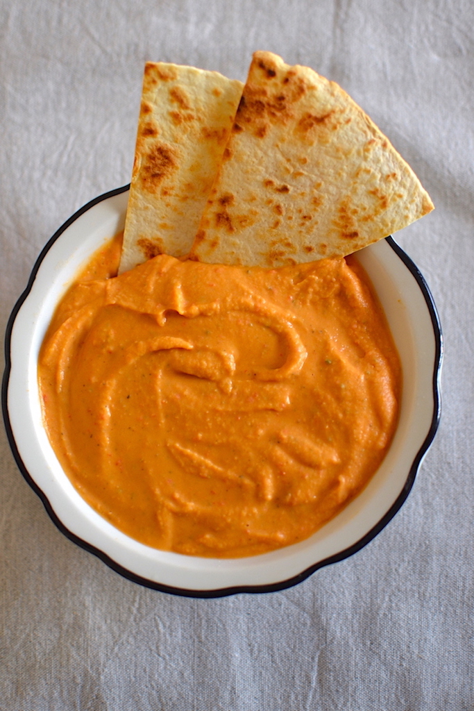 red pepper bean hummus with sliced bread