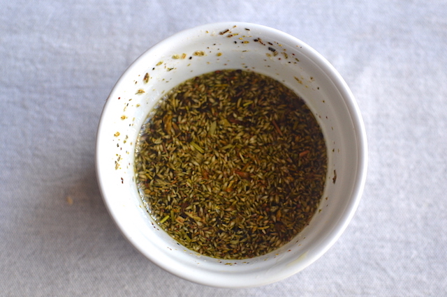 spices with olive oil in a white bowl