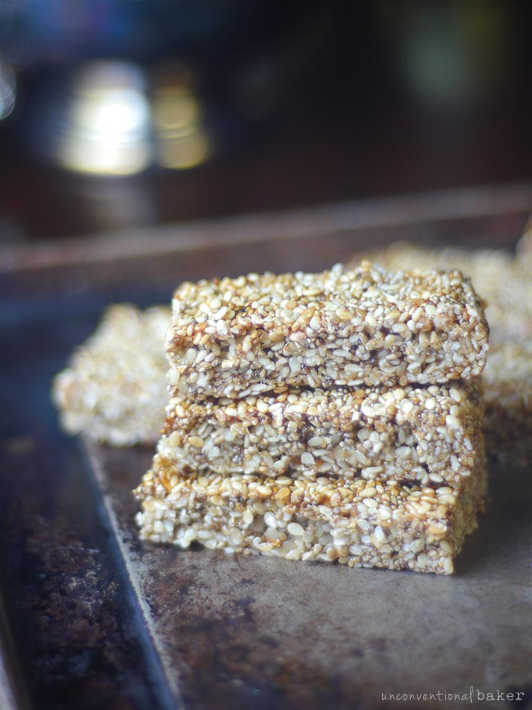sesame-seed-chia-bars in a wooden tablw