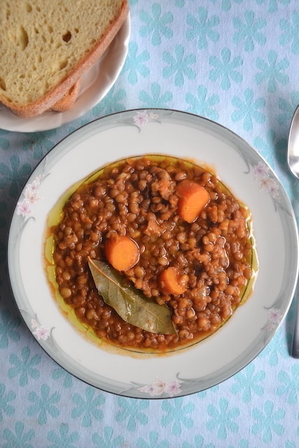 lentil soup with bay leaf in a white plate