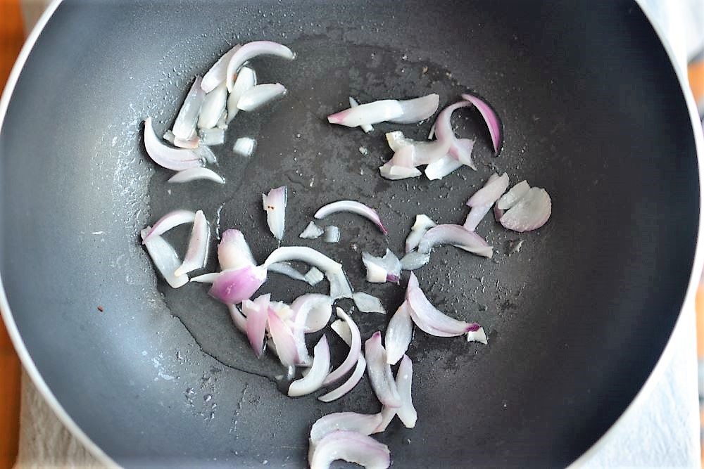 Sauteed onions in a pan
