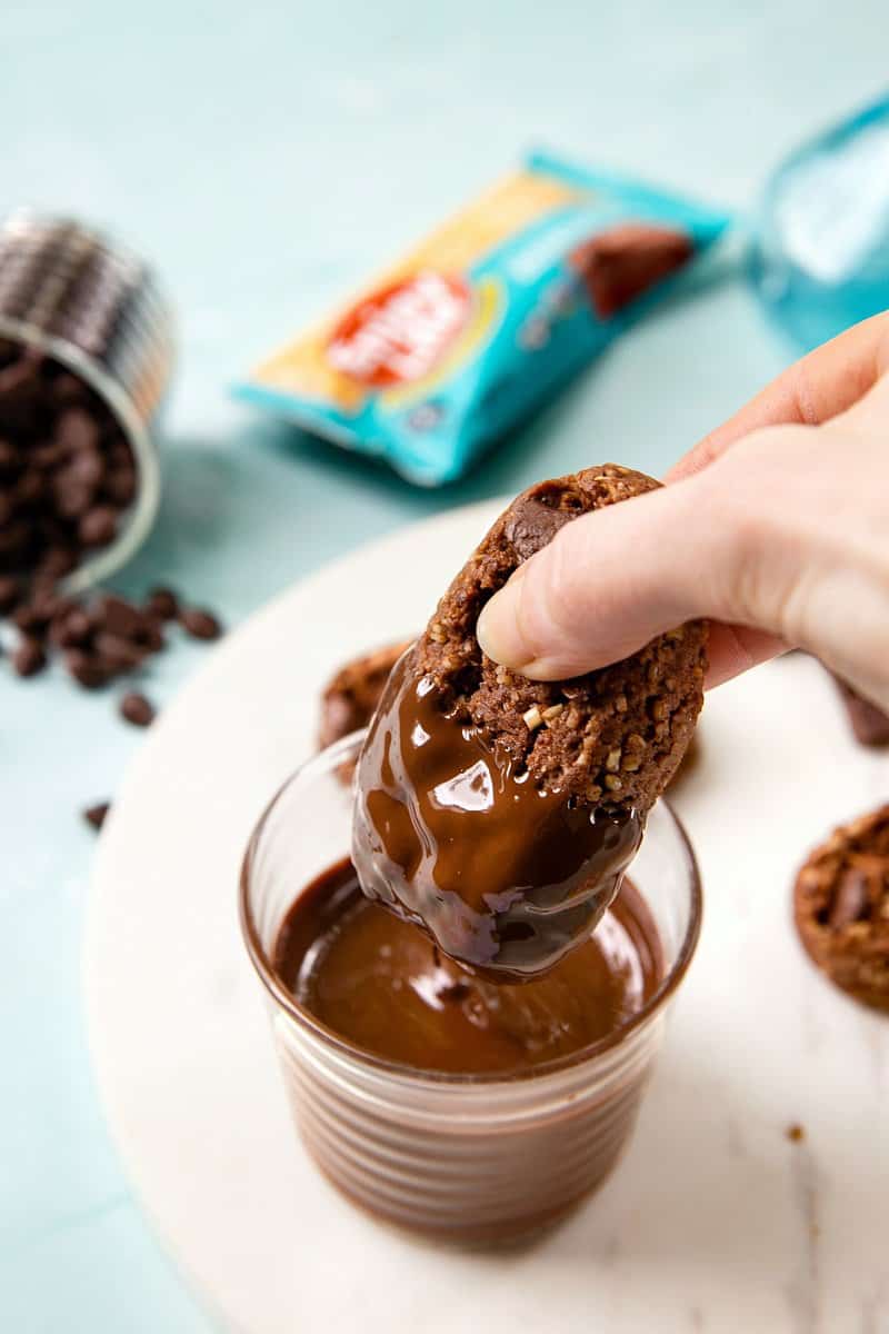 Dipping a cookie in chocolate